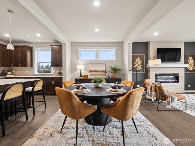 8310 115th Pl SE Unit 3, Newcastle, WA 98056 - dining area featuring recessed lighting, wood finished floors, and a tiled fireplace