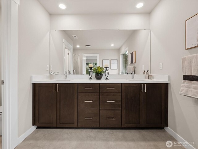 8310 115th Pl SE Unit 3, Newcastle, WA 98056 - bathroom featuring baseboards, double vanity, and recessed lighting