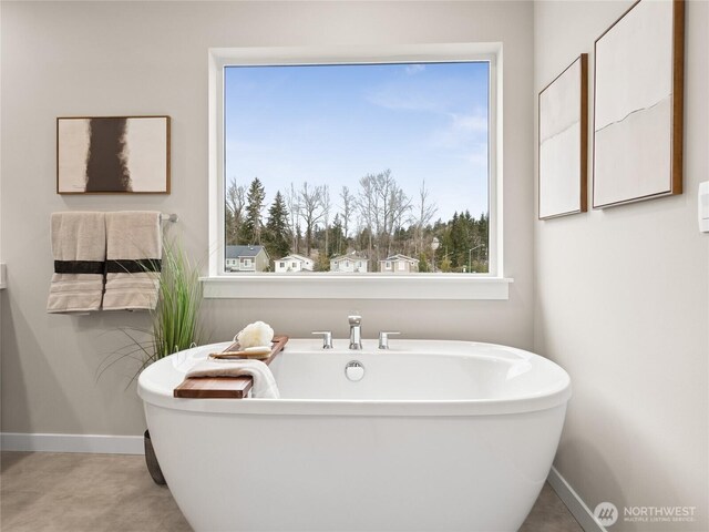 8310 115th Pl SE Unit 3, Newcastle, WA 98056 - bathroom with a soaking tub and baseboards