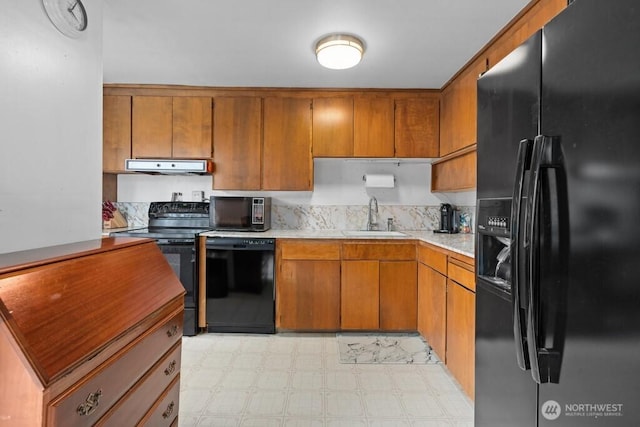 11939 SE 169th Pl, Renton, WA 98058 - kitchen featuring black appliances, a sink, under cabinet range hood, and brown cabinets