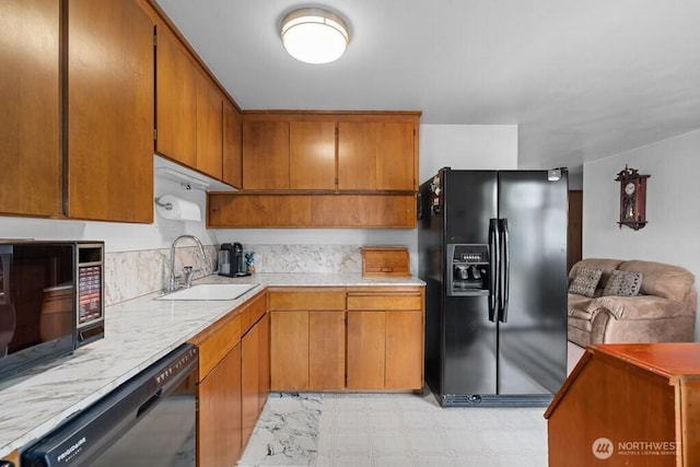 11939 SE 169th Pl, Renton, WA 98058 - kitchen featuring black appliances, a sink, light countertops, and brown cabinets