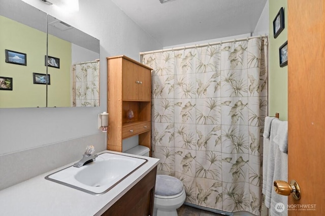11939 SE 169th Pl, Renton, WA 98058 - bathroom featuring toilet, vanity, and a shower with shower curtain