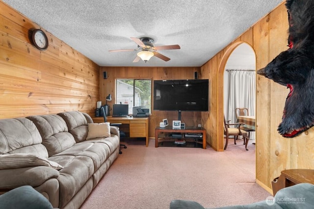 11939 SE 169th Pl, Renton, WA 98058 - carpeted living area featuring wood walls, ceiling fan, an office area, and a textured ceiling
