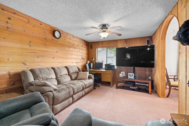 11939 SE 169th Pl, Renton, WA 98058 - living room featuring wooden walls, ceiling fan, carpet floors, a textured ceiling, and an office area