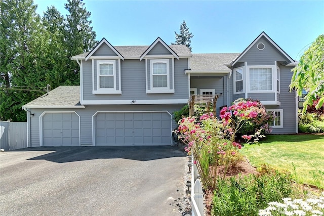 608 Harvest Rd, Bothell, WA 98012 - view of front of property with a shingled roof, an attached garage, driveway, and a front lawn