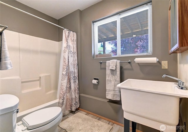 608 Harvest Rd, Bothell, WA 98012 - full bath featuring shower / tub combo with curtain and wood finished floors
