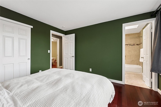 1417 S 263rd Pl, Des Moines, WA 98198 - bedroom featuring dark wood-style floors, baseboards, and ensuite bath