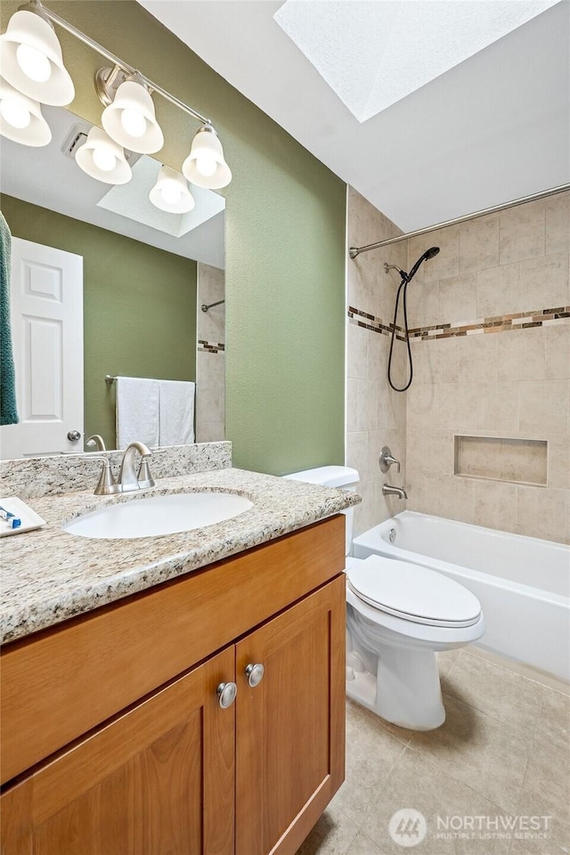 1417 S 263rd Pl, Des Moines, WA 98198 - full bathroom with a skylight, shower / tub combination, vanity, toilet, and tile patterned floors