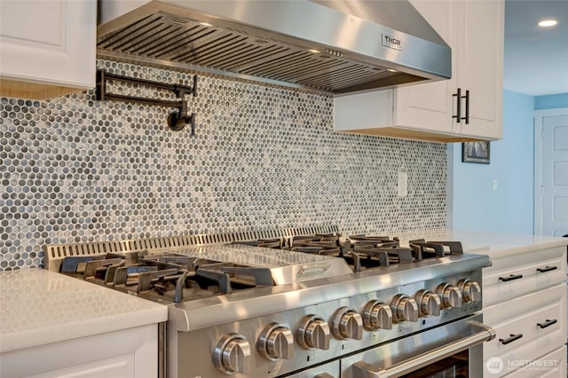18008 Ashworth Ave N, Shoreline, WA 98133 - kitchen with range hood, stainless steel stove, backsplash, and light countertops
