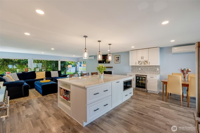 18008 Ashworth Ave N, Shoreline, WA 98133 - kitchen featuring wine cooler, black microwave, white cabinets, open floor plan, and open shelves