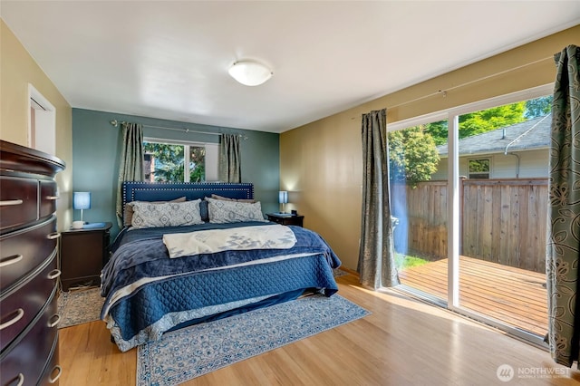 18008 Ashworth Ave N, Shoreline, WA 98133 - bedroom featuring multiple windows and wood finished floors
