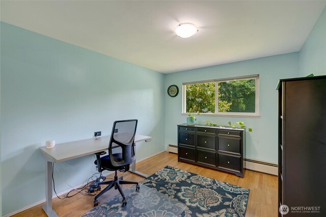 18008 Ashworth Ave N, Shoreline, WA 98133 - home office with baseboard heating, light wood-style floors, and baseboards