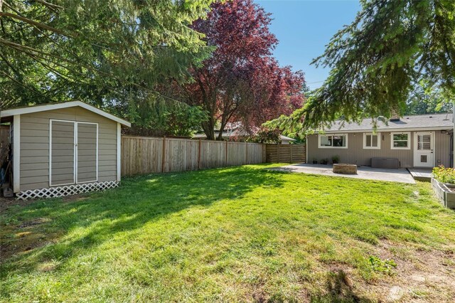 18008 Ashworth Ave N, Shoreline, WA 98133 - view of yard with a patio area and an outdoor fire pit
