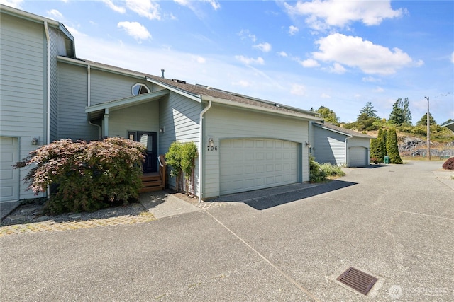 706 Finley Ln Unit S3, La Conner, WA 98257 - view of property exterior with an attached garage and driveway