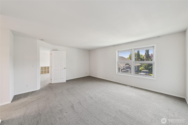 706 Finley Ln Unit S3, La Conner, WA 98257 - spare room featuring carpet and baseboards