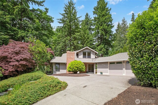 19306 SE 21st St, Sammamish, WA 98075 - view of front of property featuring a garage, driveway, and roof with shingles