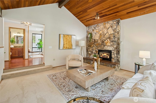 19306 SE 21st St, Sammamish, WA 98075 - living area featuring wood ceiling with exposed beams, carpet floors, a stone fireplace, baseboards, and high vaulted ceiling