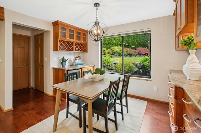 19306 SE 21st St, Sammamish, WA 98075 - dining area featuring wood finished floors, a dry bar, beverage cooler, and baseboards