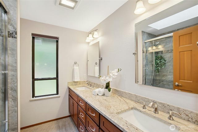 19306 SE 21st St, Sammamish, WA 98075 - bathroom with double vanity, a shower stall, and baseboards