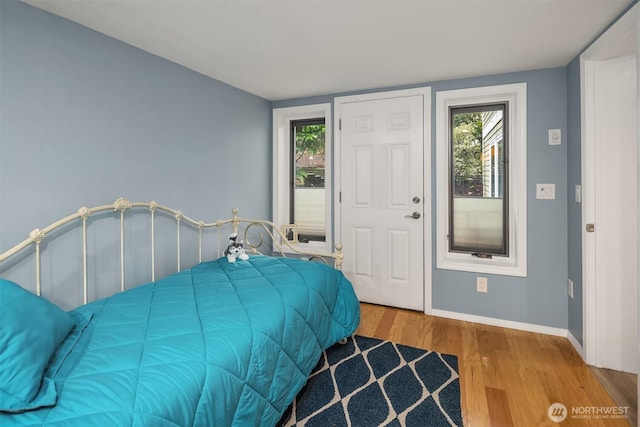 8521 E Mercer Way, Mercer Island, WA 98040 - bedroom with wood finished floors and multiple windows