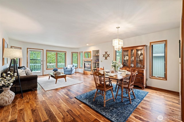4315 Village Dr Unit B, Bellingham, WA 98226 - dining area with a chandelier, wood finished floors, and baseboards