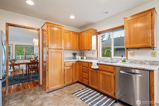 4315 Village Dr Unit B, Bellingham, WA 98226 - kitchen with stainless steel dishwasher, a sink, light stone counters, and recessed lighting