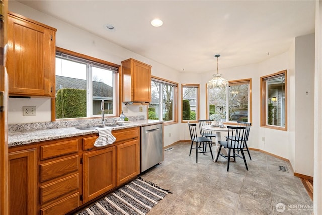 4315 Village Dr Unit B, Bellingham, WA 98226 - kitchen featuring dishwasher, brown cabinets, a sink, baseboards, and recessed lighting