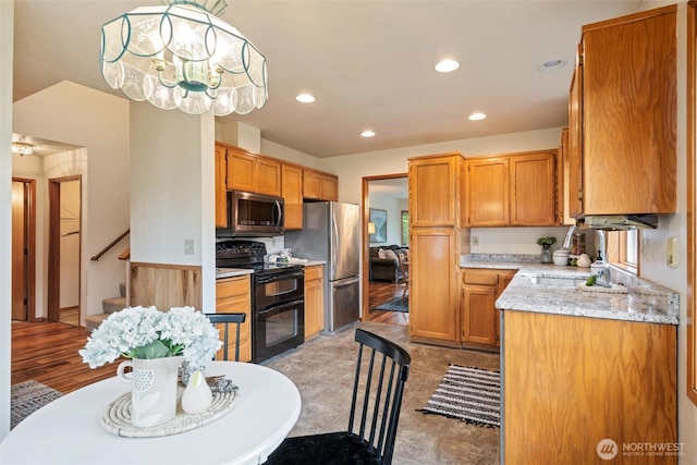 4315 Village Dr Unit B, Bellingham, WA 98226 - kitchen with stainless steel appliances, a sink, recessed lighting, and brown cabinetry