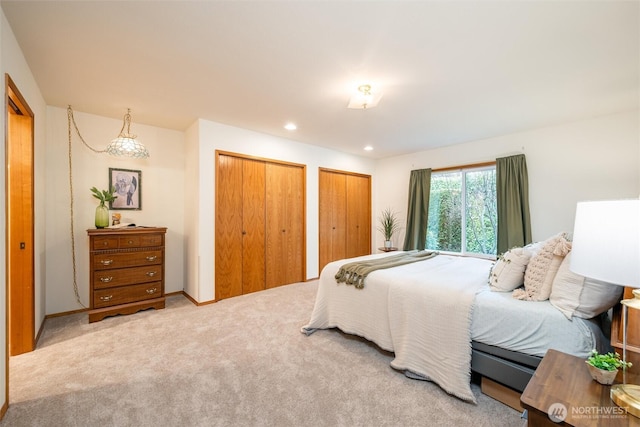 4315 Village Dr Unit B, Bellingham, WA 98226 - bedroom featuring multiple closets, light colored carpet, recessed lighting, and baseboards