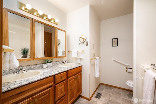 4315 Village Dr Unit B, Bellingham, WA 98226 - full bathroom with double vanity, baseboards, and toilet