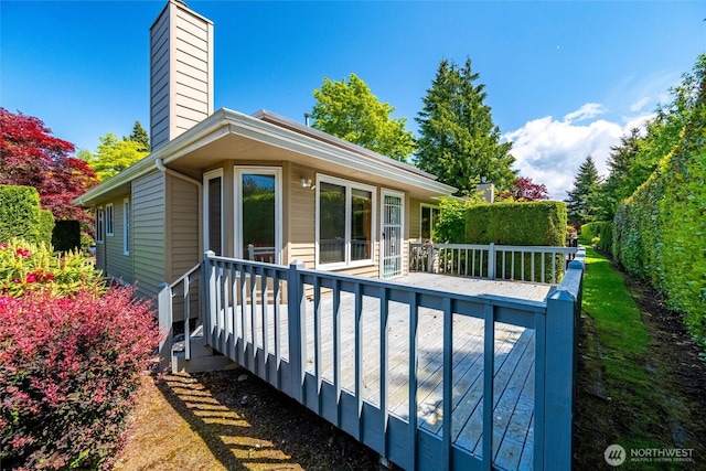 4315 Village Dr Unit B, Bellingham, WA 98226 - back of property with a chimney and a wooden deck