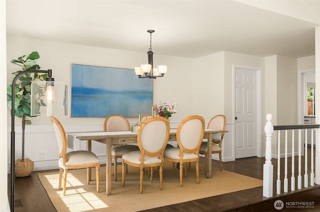 21024 NE 36th St, Sammamish, WA 98074 - dining space with wood finished floors, a chandelier, and baseboards