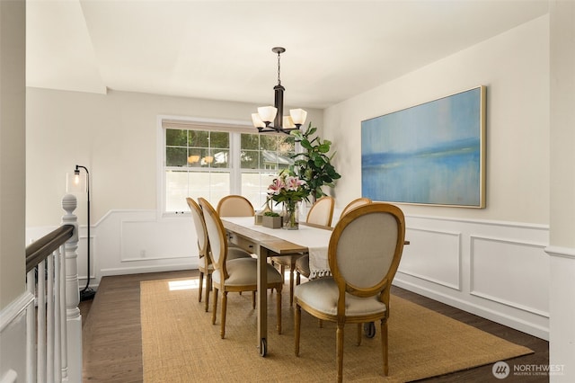 21024 NE 36th St, Sammamish, WA 98074 - dining room with wood finished floors, a chandelier, a decorative wall, and wainscoting