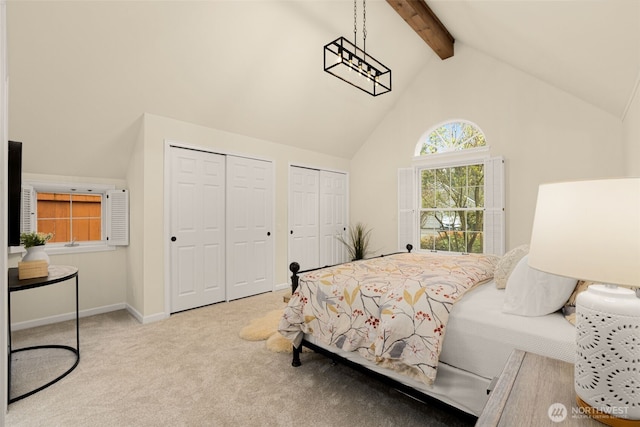 21024 NE 36th St, Sammamish, WA 98074 - carpeted bedroom with multiple closets, beamed ceiling, high vaulted ceiling, and baseboards