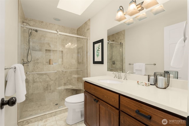 21024 NE 36th St, Sammamish, WA 98074 - bathroom with a skylight, vanity, toilet, and a stall shower