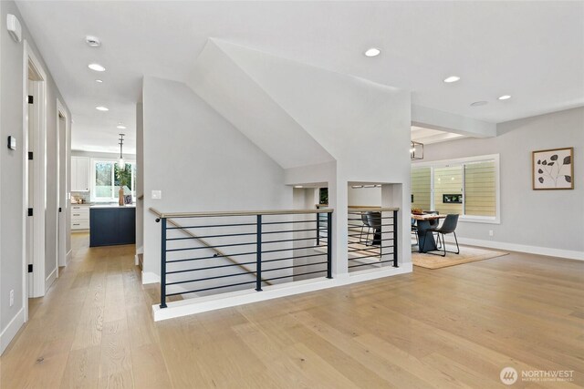 15535 NE 60th St, Redmond, WA 98052 - hall with an upstairs landing, wood finished floors, baseboards, and recessed lighting