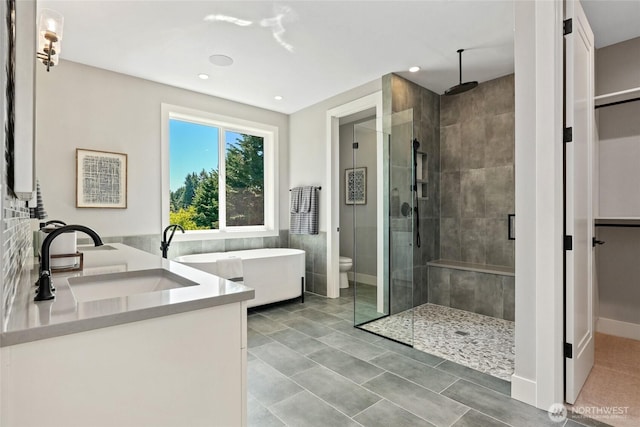 15535 NE 60th St, Redmond, WA 98052 - full bathroom with a shower stall, vanity, a freestanding tub, toilet, and recessed lighting