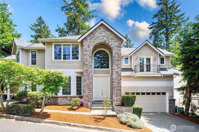 7817 NE 112th St, Kirkland, WA 98034 - traditional-style home featuring a balcony, brick siding, an attached garage, driveway, and french doors