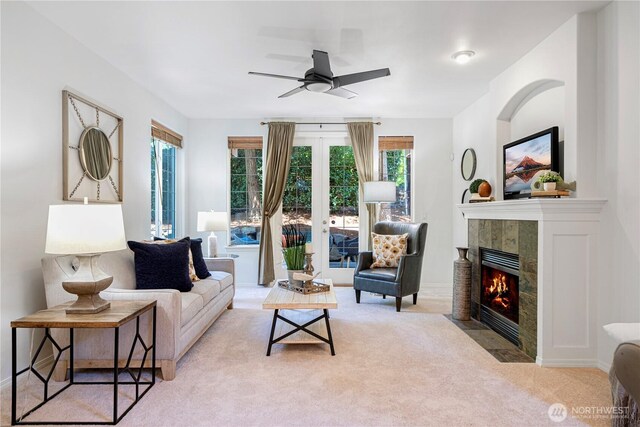 7817 NE 112th St, Kirkland, WA 98034 - carpeted living room featuring ceiling fan, a tile fireplace, and french doors