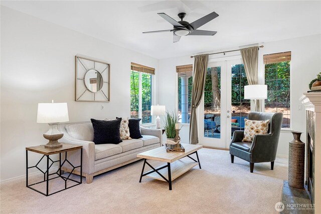 7817 NE 112th St, Kirkland, WA 98034 - carpeted living room featuring plenty of natural light, french doors, a ceiling fan, and baseboards