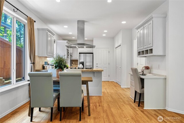 7817 NE 112th St, Kirkland, WA 98034 - dining room featuring light wood finished floors, baseboards, and recessed lighting