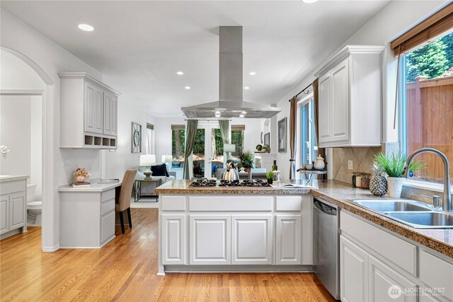 7817 NE 112th St, Kirkland, WA 98034 - kitchen featuring island exhaust hood, a sink, dishwasher, a peninsula, and white cabinetry