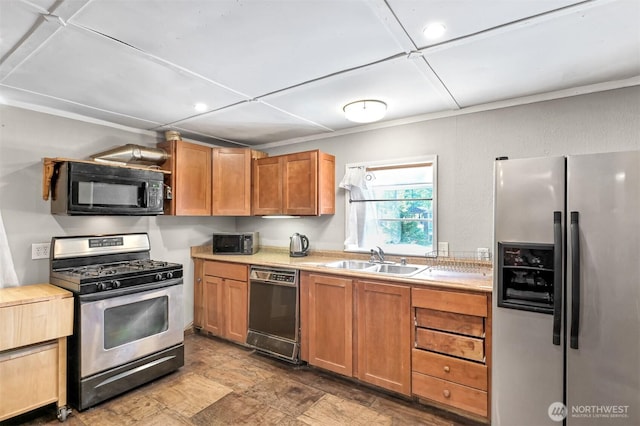 8445 Golden Valley Dr, Maple Falls, WA 98266 - kitchen with black appliances, light countertops, a sink, and stone finish flooring