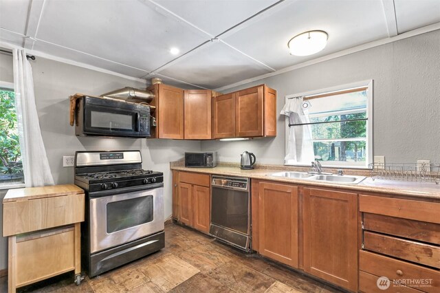 8445 Golden Valley Dr, Maple Falls, WA 98266 - kitchen with black appliances, a sink, light countertops, plenty of natural light, and a textured wall