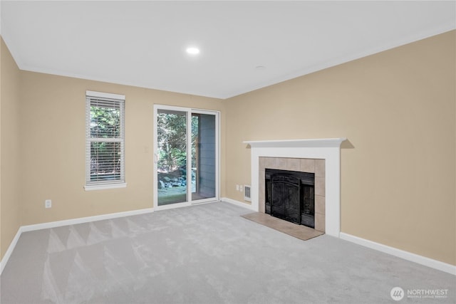 11102 NE 125th Ln Unit K136, Kirkland, WA 98034 - unfurnished living room featuring carpet floors, baseboards, and a tiled fireplace