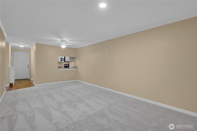 11102 NE 125th Ln Unit K136, Kirkland, WA 98034 - unfurnished room featuring carpet floors, a ceiling fan, ornamental molding, and baseboards