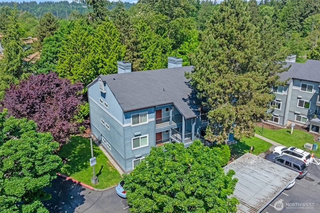 11102 NE 125th Ln Unit K136, Kirkland, WA 98034 - aerial view of property and surrounding area with a forest