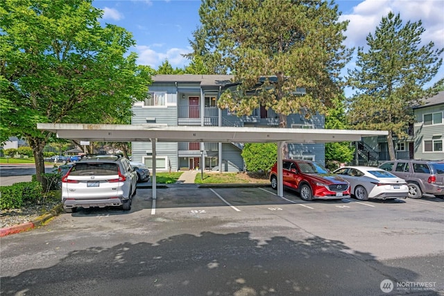 11102 NE 125th Ln Unit K136, Kirkland, WA 98034 - view of front of property with covered parking and stairway