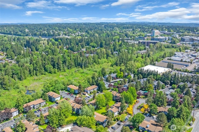 11102 NE 125th Ln Unit K136, Kirkland, WA 98034 - aerial view of property and surrounding area featuring a heavily wooded area