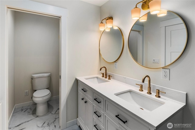 401 Flair Valley Ct, Maple Falls, WA 98266 - full bathroom featuring marble finish floors, double vanity, baseboards, and toilet